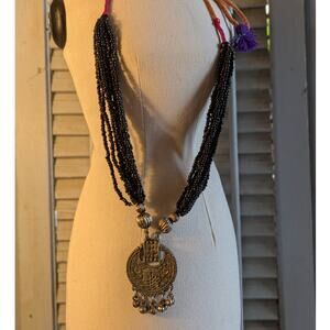 Handcrafted tribal style statement necklace with seed beads